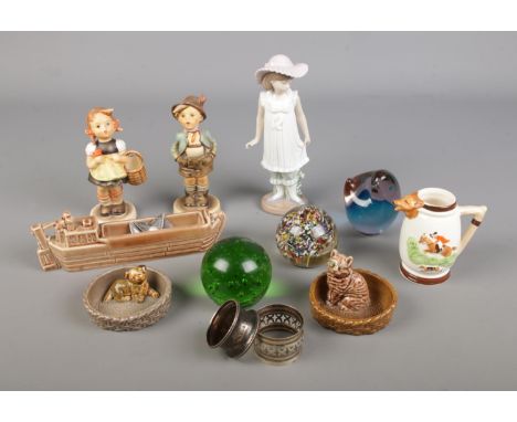A quantity of mixed collectables including Goebel figures, Nao Figurine, Wade, Glass Paperweights, Silver napkin ring etc.
