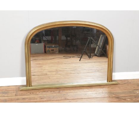 A gilt framed over mantle mirror, with arched top. Produced by Gallery Framing, Piedmont model. Height: 78cm, Width: 121cm.