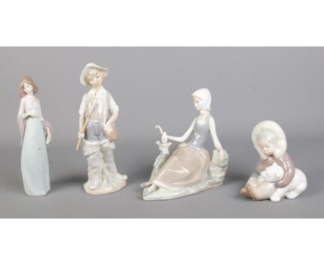 Four Lladro ceramic figure groups, to include 4809 Fisher Boy, Shepherdess and 1195 Eskimo.  Arm repaired on woman standing w