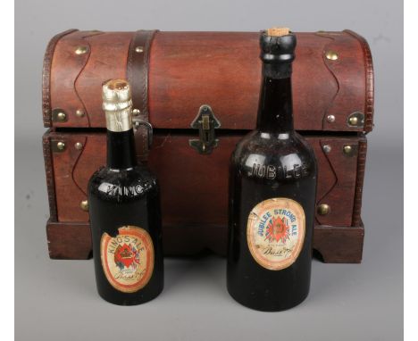 Two bottles of Bass ale to include Jubilee Strong 1977 and Kings Ale 1902 in decorative leather trunk.