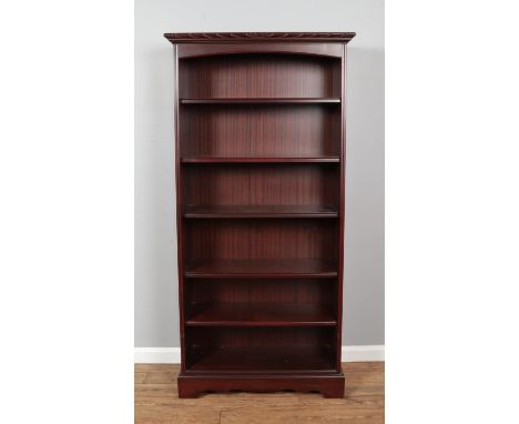 A John E Coyle mahogany five shelf open bookcase. Height: 184cm, Width: 90cm, Depth: 37cm.