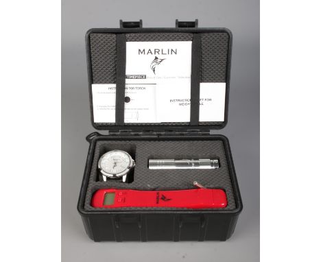 A Marlin quartz wristwatch, 50m WR, with booklet, scales and torch, in hard case.  In working order. Slight scratch between 1