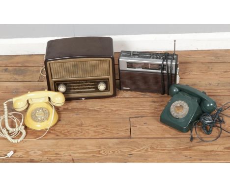 A Bakelite cased Bush type VHF 70 vintage radio along with Rad 28 Radio and two vintage rotary telephones.