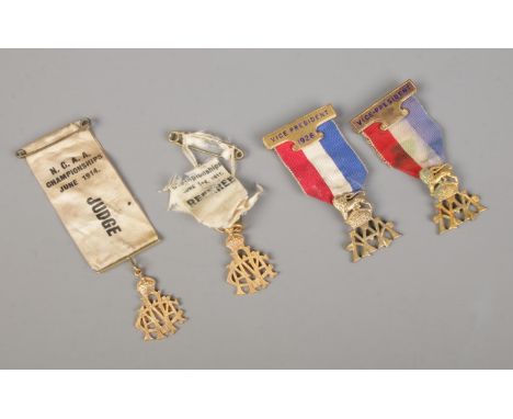 A group of four vintage athletics badges, including AAA vice-president and NCAA judge/referee badges.  Signs of wear and tear