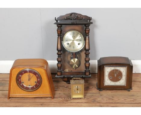 A box of assorted clocks to include two Smiths Enfield mantle clocks, modern pendulum wall clock and Maxim quartz carriage cl