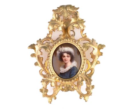 A German porcelain oval portrait plaque, in the manner of Rembrandt, with a shoulder-length portrait of a young girl with whi
