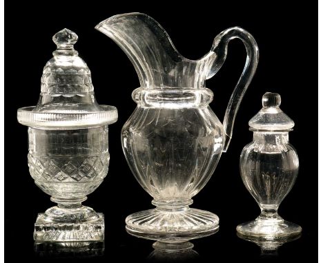 An early 19th Century Irish cut glass preserve jar and bell shaped cover, cut with hobnail and trellis on a moulded lemon squ