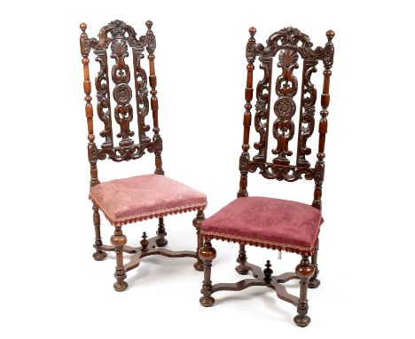 A pair of Victorian mahogany high back chairs, in the William and Mary style, the scrolled and pierced splats flanked by turn