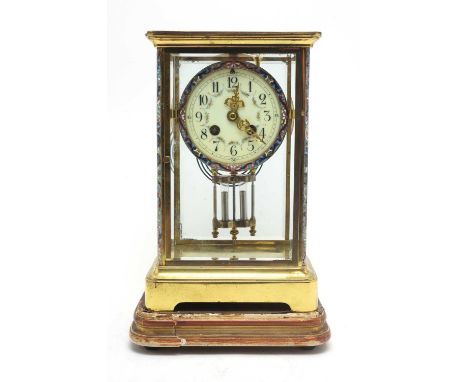 An early 20th Century lacquered brass-cased French mantel clock, the cream enamel arabic dial with floral garlands within cha