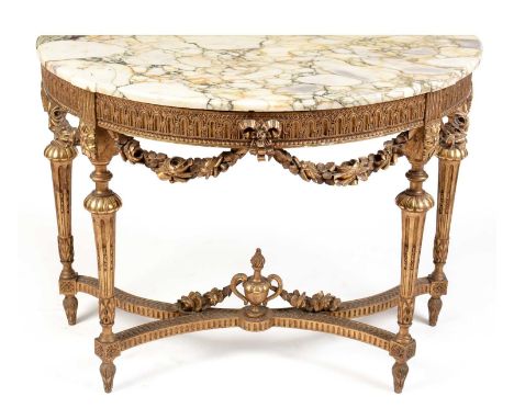 A Regency style marble-topped console table, with veined marble top above an arcaded frieze with carved gilt swags, raised on