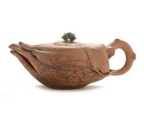 An unusual Chinese YiXing red stoneware teapot and cover, in the form of a finger citron with branch and leaf handle, later g