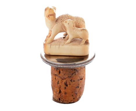 A 19th Century Japanese ivory netsuke in the form of a ewe and lamb, later fitted onto a hallmarked silver mount with cork st