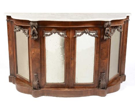 A Victorian walnut and Carrara marble-topped serpentine chiffonier, the shaped marble top above a central pair of mirrored an