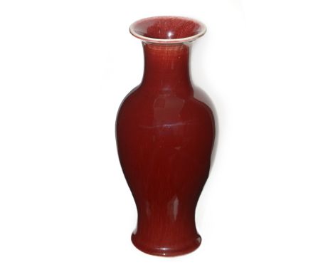 A Chinese vase, of inverted baluster form with 'sang de boeuf' red glaze, Jingdezhen blue seal mark, 26cms.