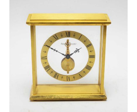 A 1970's Jaeger LeCoultre desk clock, the brass chapter with roman hours with eight-day inline movement, contained within a b