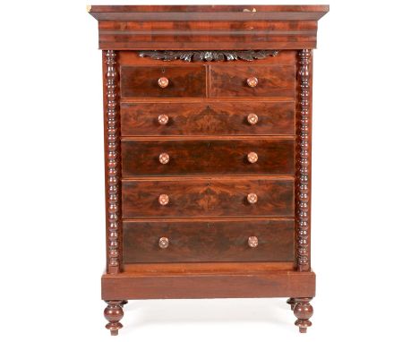 A Victorian mahogany Scotch chest of drawers, the projecting cornice above an arrangement of two short over four long graduat