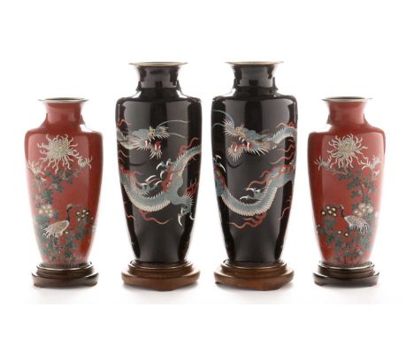 A pair of early 20th Century Japanese cloisonne vases by Aihara Shoten, decorated with dragons on a dark blue enamel ground, 
