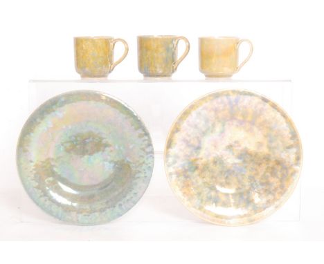 Ruskin Pottery - Five pieces of assorted lustre glaze comprising three coffee cans and two footed saucers, various marks (5)