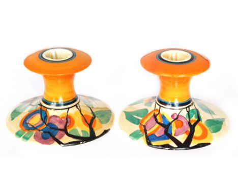 Clarice Cliff - Circle Tree (R.A.F. Tree) - A pair of shape 310 candlesticks circa 1929 hand painted with a stylised tree lan