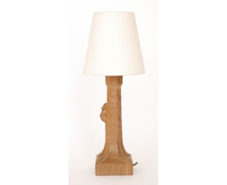 Robert 'Mouseman' Thompson - An oak table lamp of tapered octagonal form in an adzed finish, with foliate carved square base 