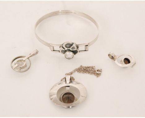 Auran Kultaseppä Oy - A large Finnish silver heart shaped pendant with central circular facet cut smoky quartz and another sm