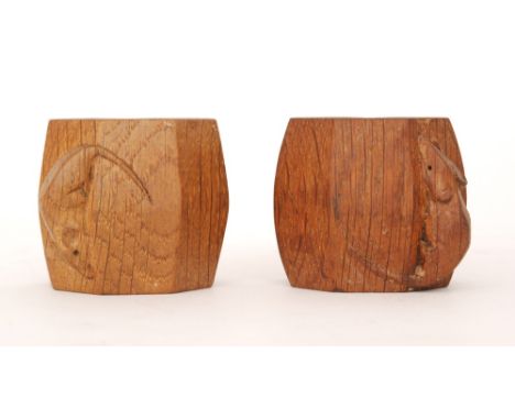 Robert 'Mouseman' Thompson - A pair of oak napkin rings of octagonal form, with carved 'mouse signatures', height 5cm. (2)