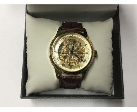 A boxed Rotary automatic skeleton gents watch