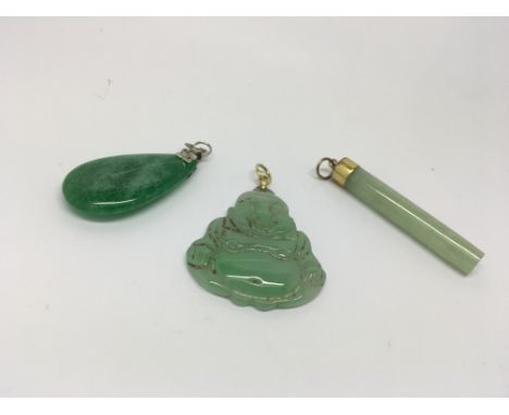 3 Jade brooches one in the shape of a Buddha