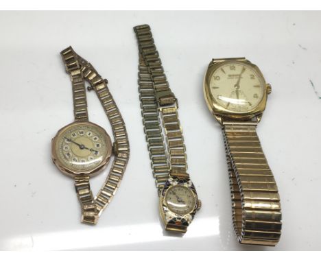 Three watches including one with rose gold face, another with enamel dial