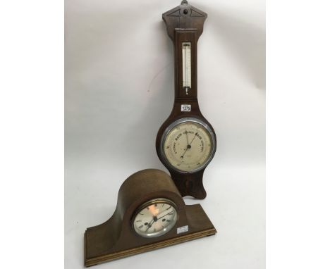 A Napoleon mantle clock and oak wall barometer