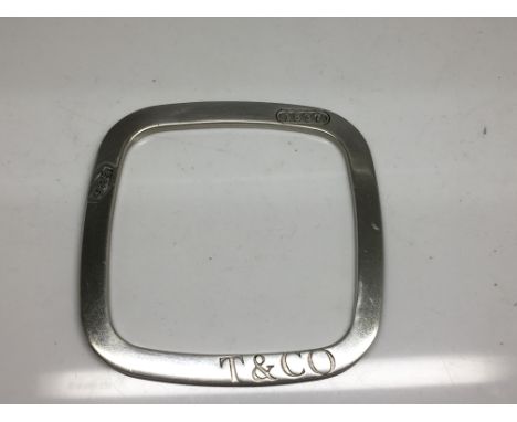 A tested, solid 925 silver square bangle, stamped T&Co..Approx 42.5g