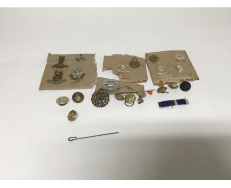 A small collection of WW1 & WW2 military badges