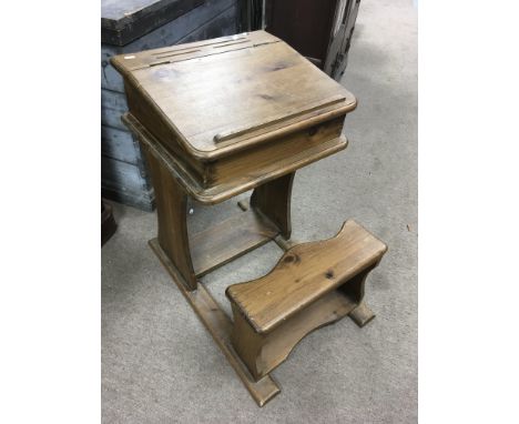 A child’s wooden desk with integrated seat