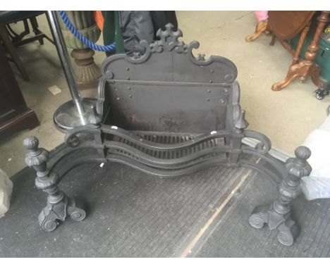 A wrought iron fire gate.