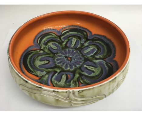 A 1960’s Poole pottery bowl painted with a bold flower. Approx 27cm diameter