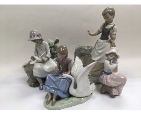 Six Lladro and Nao figures including two boxed.