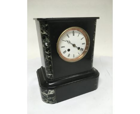 An 8 day slate and marble mantle clock.