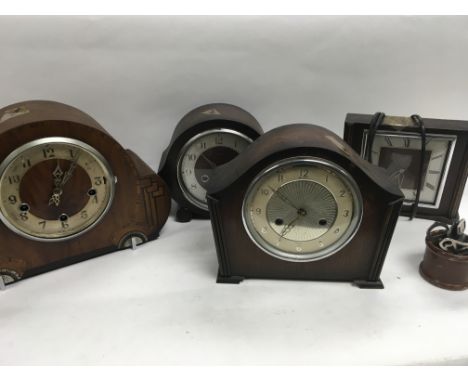 A collection of mantle clocks including an electric example from Smiths And a collection of various clock keys.