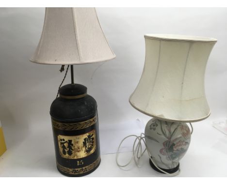 A pair of oriental lamps, one made in the form of a tea canister and the other a ceramic lamp with a floral design.