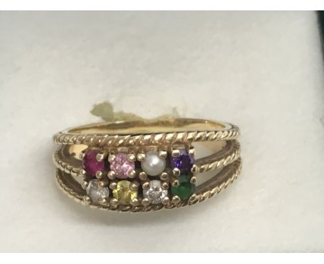 A 10k gold multistone set ring. Approx size R