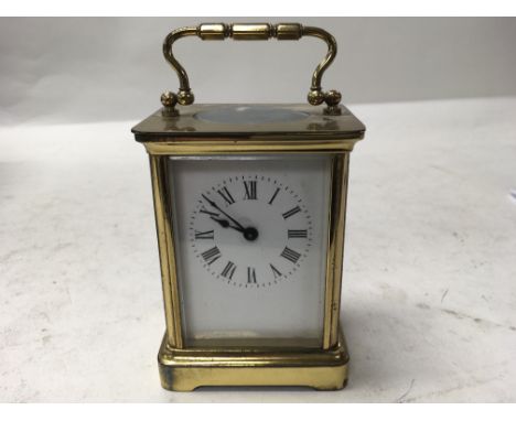 A brass cased carriage clock.