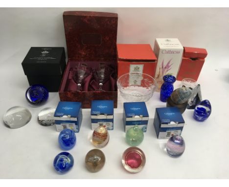 A collection of Caithness paperweights and boxed glassware