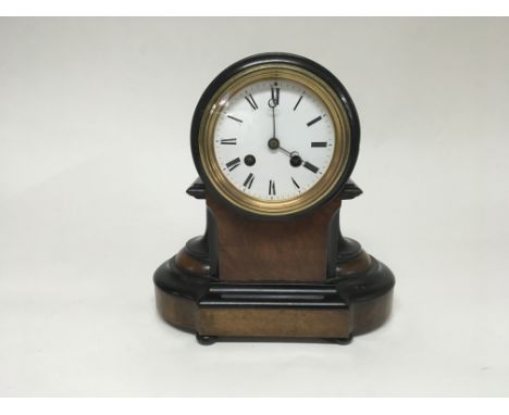 A mantle clock manufactured by La Matilda de J. morales in habana. Includes a key and pendulum.