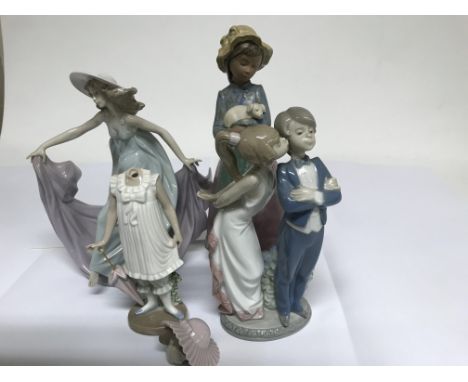 A collection of figures comprising two lladro and nao