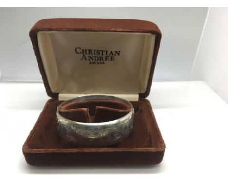 A boxed engraved silver bangle, Birmingham 1973/74