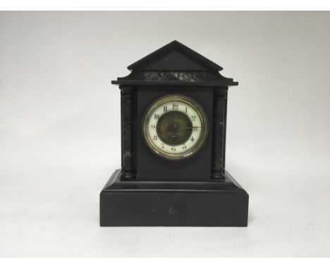 A Victorian mantle clock with marble accents.