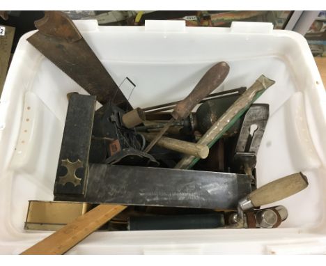 A box of old tools including a plane