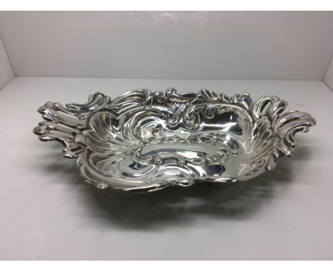 A silver embossed dish marked for H/M Birmingham