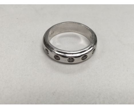 A 9ct white gold set with five diamond chips, approx 5g and approx size L-M.