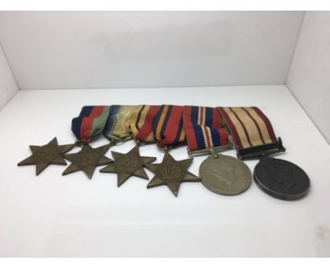 A WW2 medal group, recipient “Finnigan” comprising of the Atlantic Star, Africa star, Atlantic Star, Burma Star, 1939-1945 St